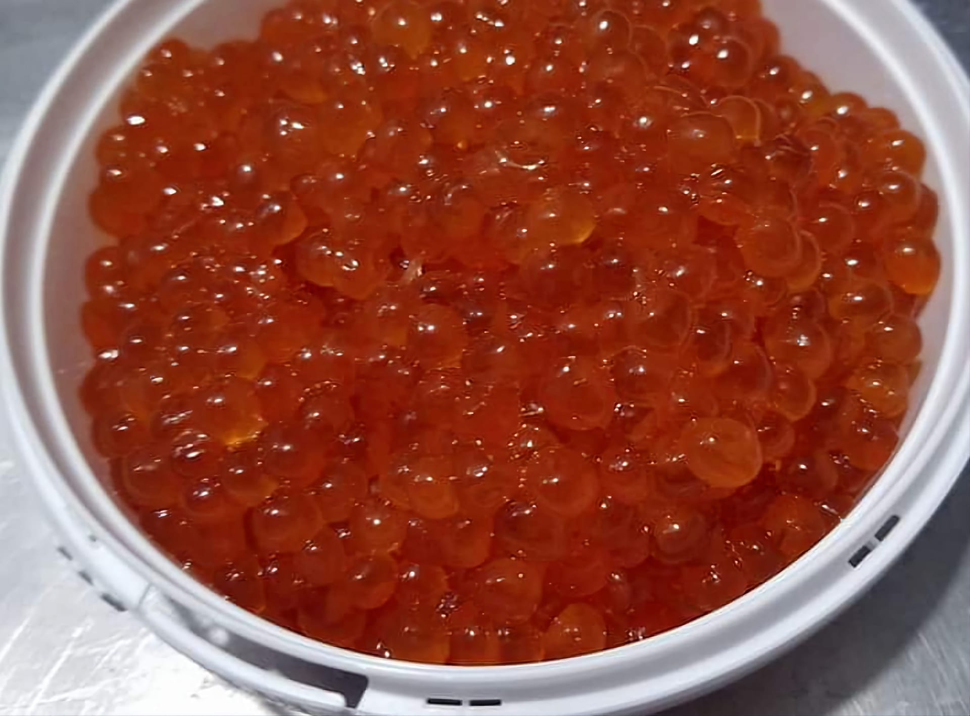 Fresh salmon caviar opened jar