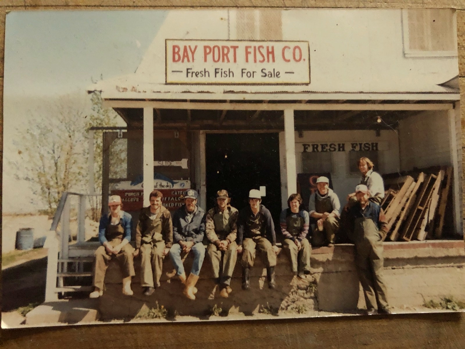 Group photo in front of the Bay Port fish company