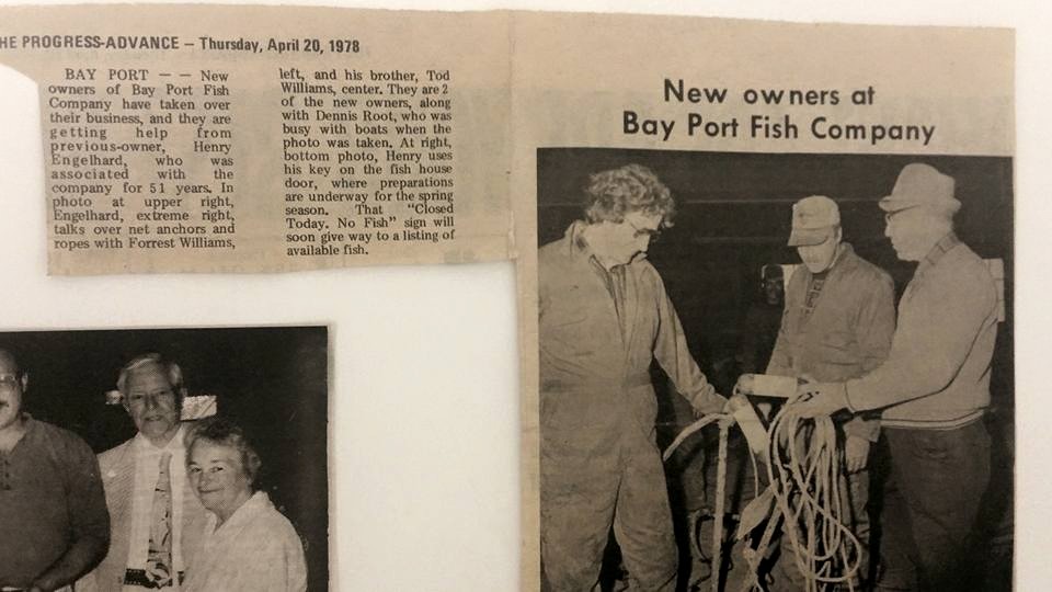 Looking over anchors and other equipment as the new owners of Bay Port fish company