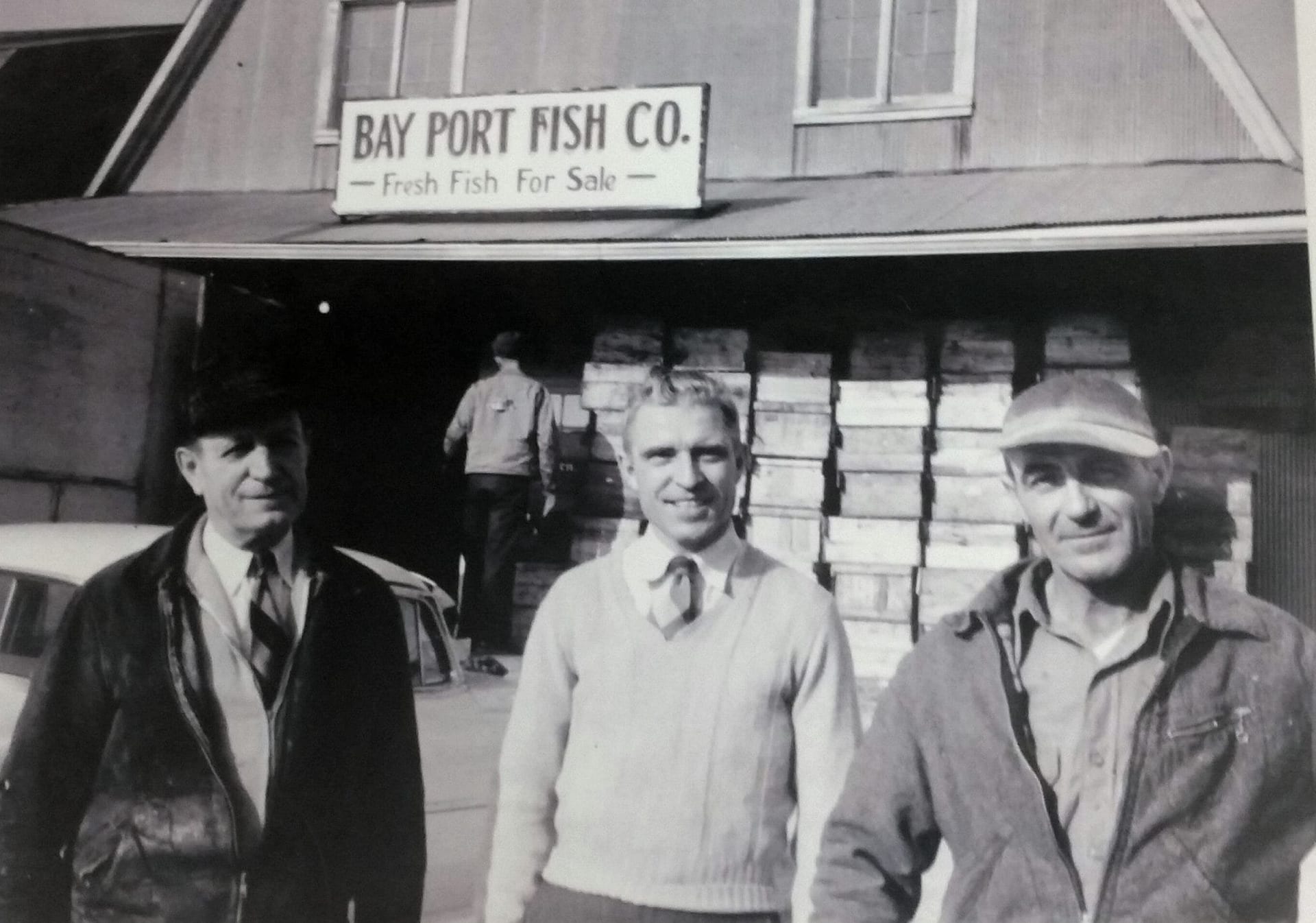 Previous Owners, Melvin Dutchrr, Otto Schmidt, and Henry Engelhard pose in front of Bay Port Fish 1940s.